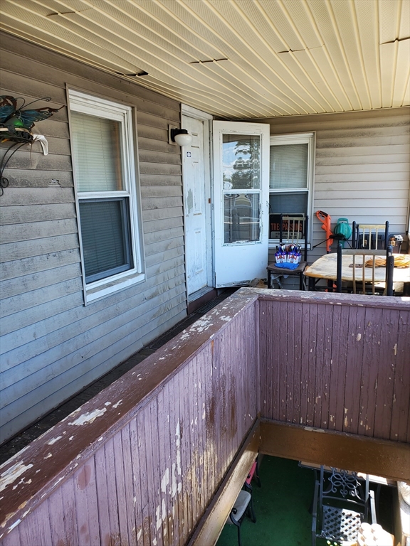10-12 Carnes Street Lynn, MA 01905 - Photo 12 of 21 a backyard of a house with seating space