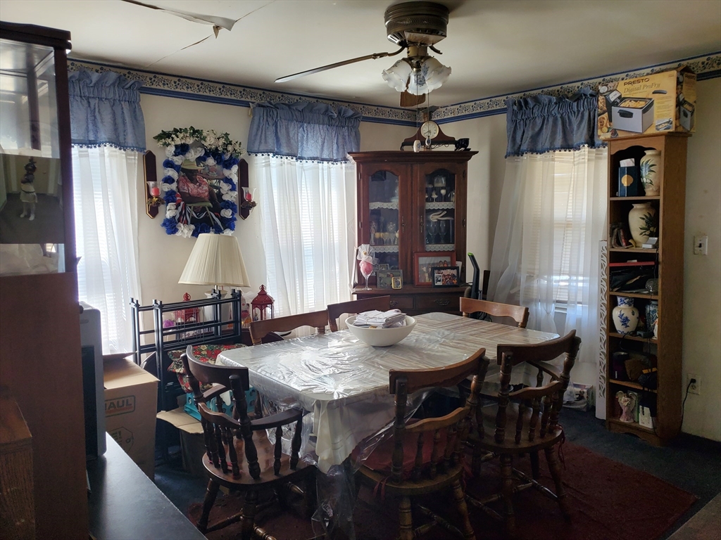 10-12 Carnes Street Lynn, MA 01905 - Photo 14 of 21 a view of a dining room with furniture window and wooden floor