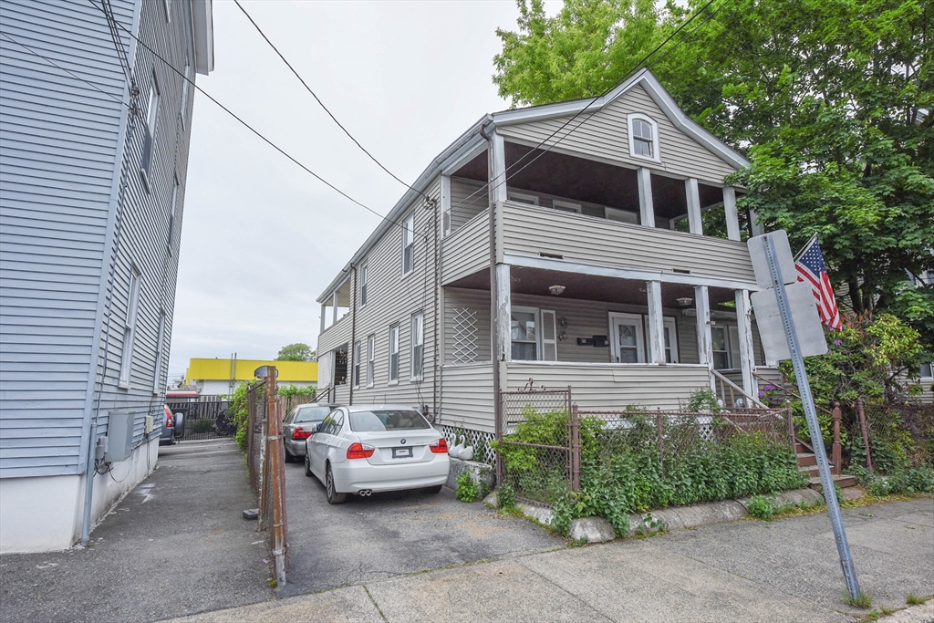 10-12 Carnes Street Lynn, MA 01905 - Photo 2 of 21 a view of multiple houses with a street