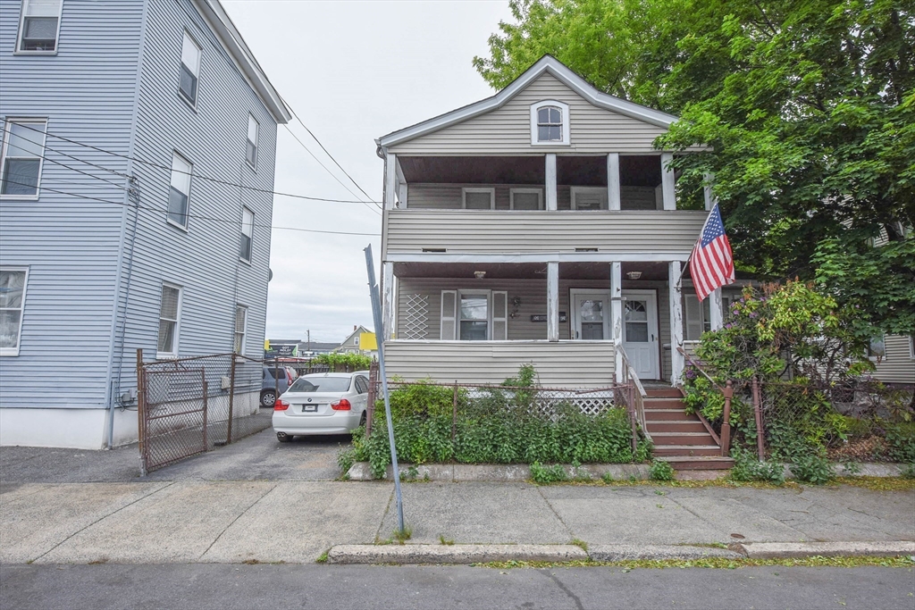 10-12 Carnes Street Lynn, MA 01905 - Photo 3 of 21 a front view of a house with a yard