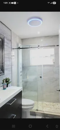 a bathroom with a sink and a shower