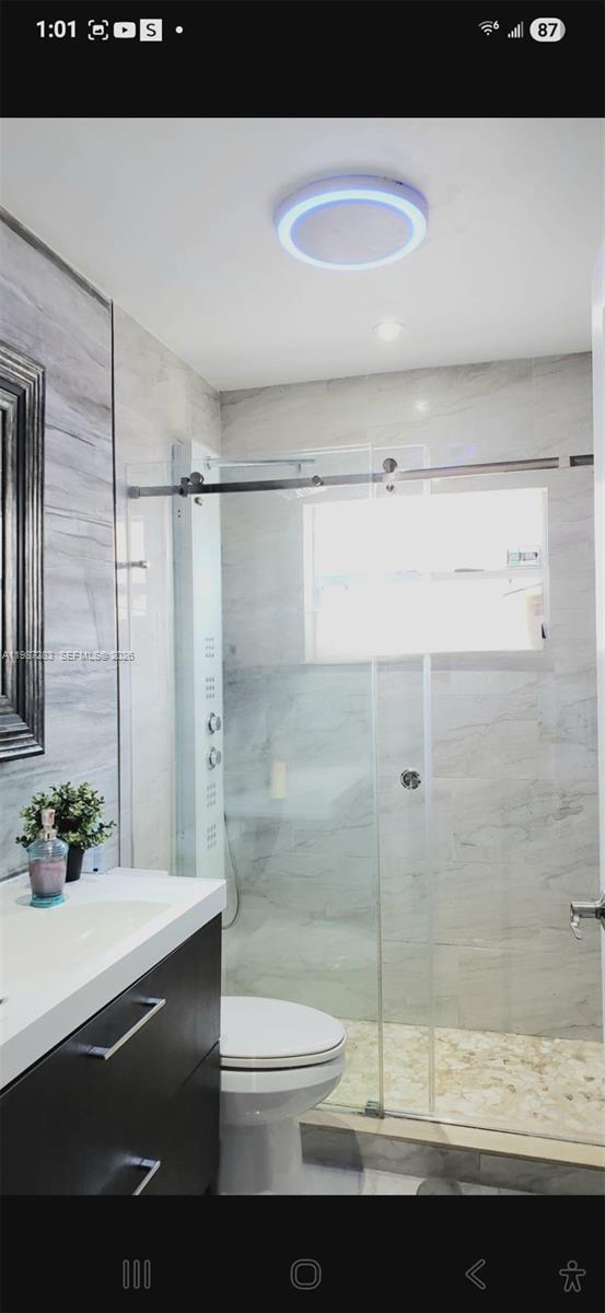 8003 Southwest 158th Place Miami, FL 33193 - Photo 11 of 20 a bathroom with a sink and a shower