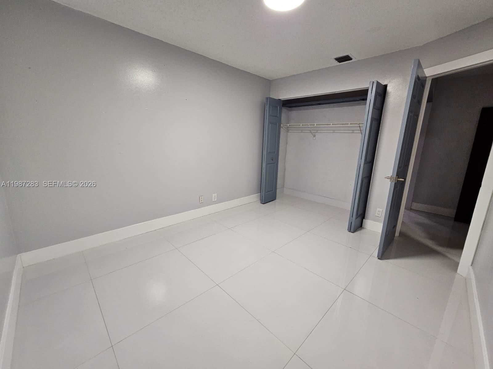 8003 Southwest 158th Place Miami, FL 33193 - Photo 13 of 20 a view of an empty room