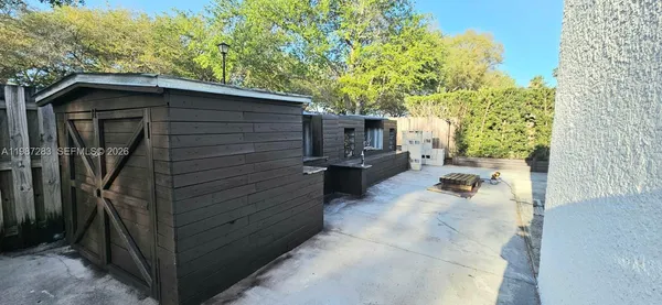 a backyard of a house with seating space