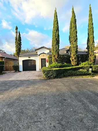 a view of a garden with large buildings