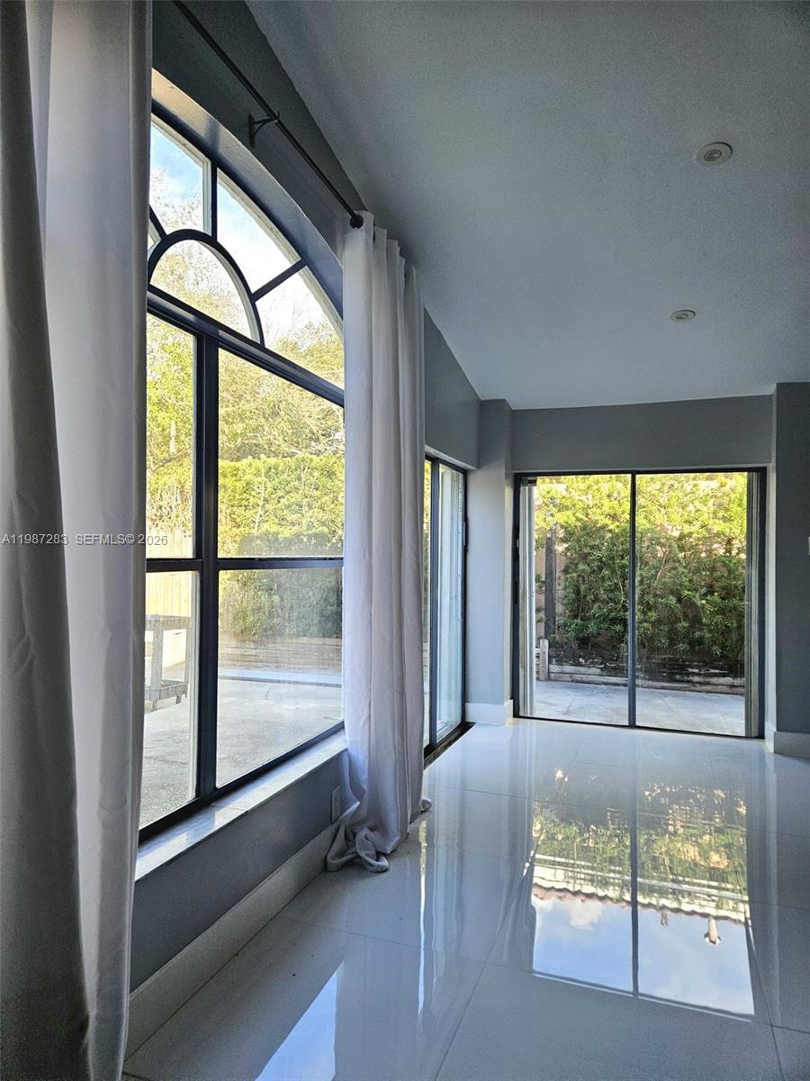 8003 Southwest 158th Place Miami, FL 33193 - Photo 10 of 20 a living room with a large window