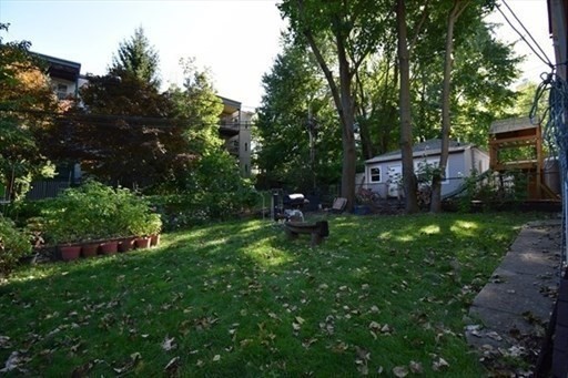 59 Centre Street, Unit PH Boston, MA 02124 - Photo 12 of 13 a house view with a sitting space and garden