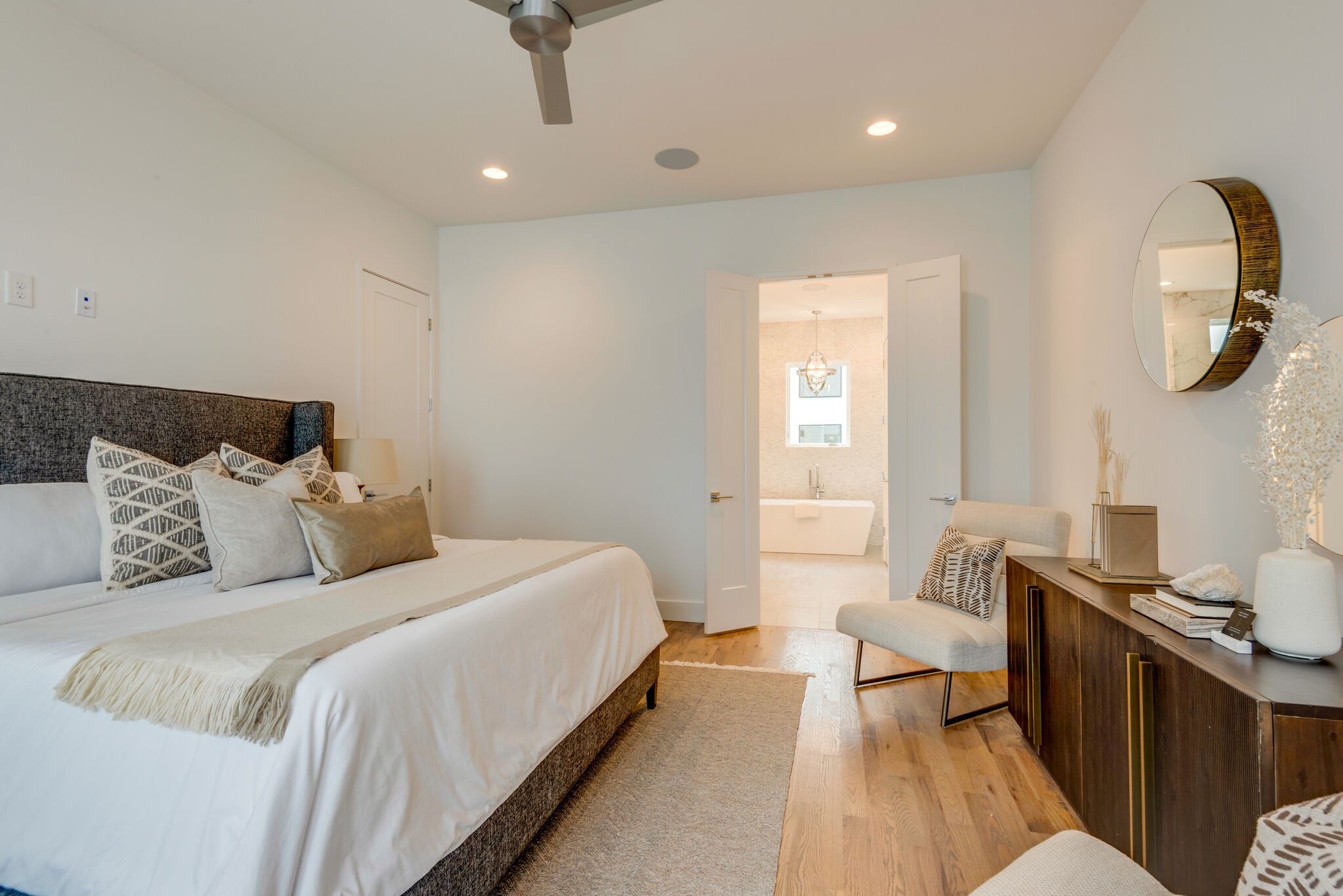 1022 B 9th Avenue South Nashville, TN 37203 - Photo 31 of 38 a bedroom with a bed and a chandelier