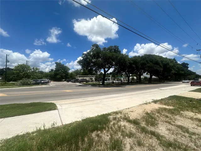 a view of yard with swimming pool and green space