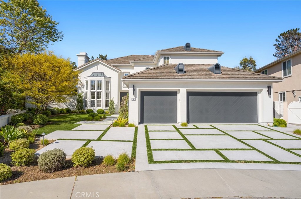 3 Bridgeport Road Newport Coast, CA 92657 - Photo 2 of 25 a front view of a house with a garden