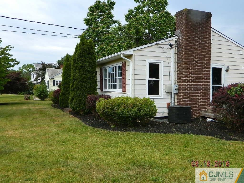 678 Ridge Road Monmouth Junction, NJ 08852 - Photo 2 of 9 a view of a house with backyard and garden