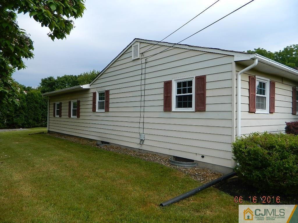 678 Ridge Road Monmouth Junction, NJ 08852 - Photo 6 of 9 a view of a house with a backyard