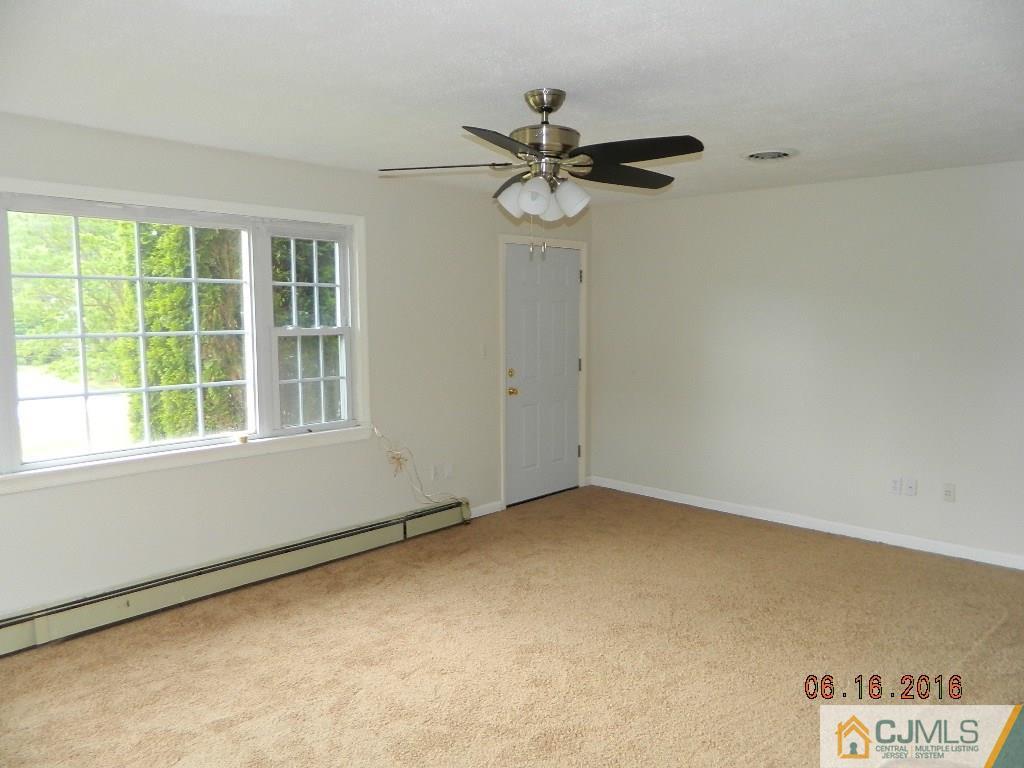 678 Ridge Road Monmouth Junction, NJ 08852 - Photo 7 of 9 an empty room with a window