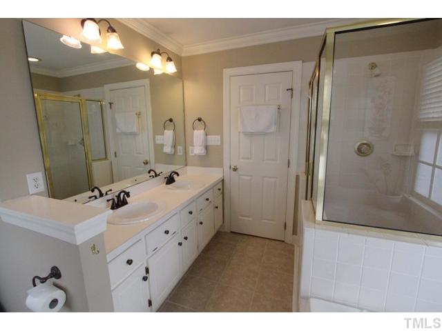 2708 Dahlgreen Road Raleigh, NC 27615 - Photo 14 of 25 a bathroom with a double vanity sink mirror and shower