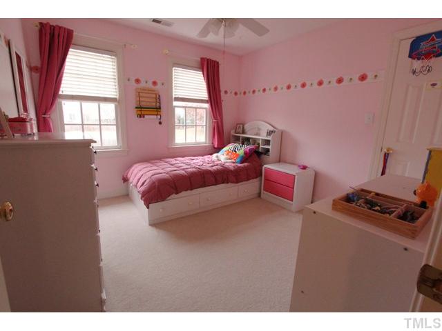 2708 Dahlgreen Road Raleigh, NC 27615 - Photo 16 of 25 a bedroom with a bed and a window