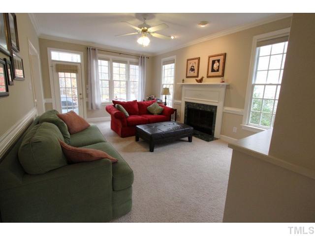 2708 Dahlgreen Road Raleigh, NC 27615 - Photo 9 of 25 a living room with furniture and a fireplace