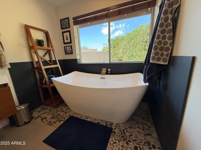 a white bath tub sitting in a bathroom