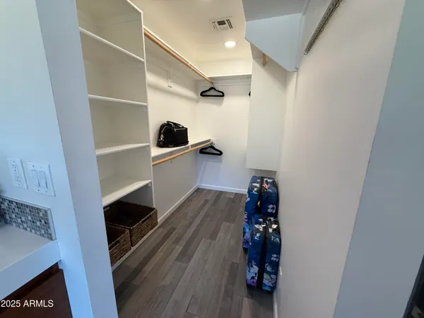 a room with furniture and wooden floor