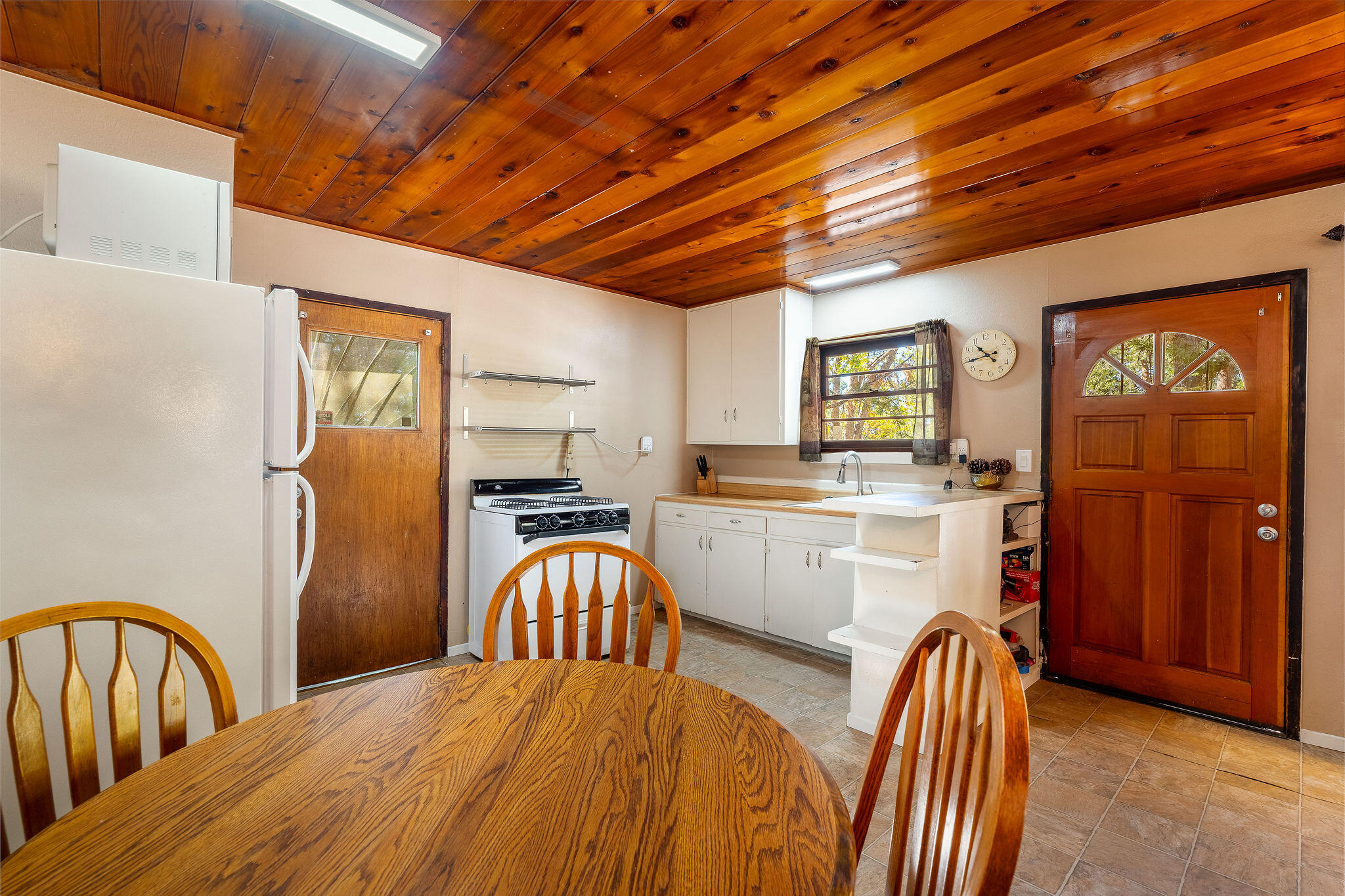 25290 Lodge Road Idyllwild, CA 92549 - Photo 11 of 46 a kitchen with stainless steel appliances granite countertop a refrigerator a stove top oven a sink and dishwasher