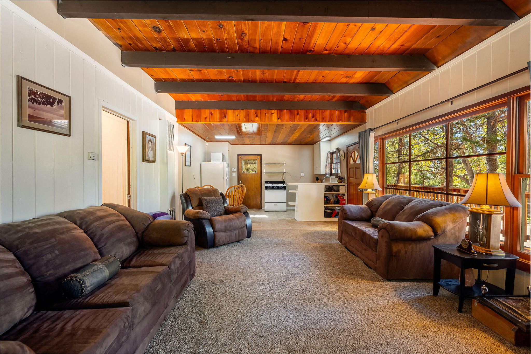 25290 Lodge Road Idyllwild, CA 92549 - Photo 13 of 46 a living room with furniture a ceiling fan and a window