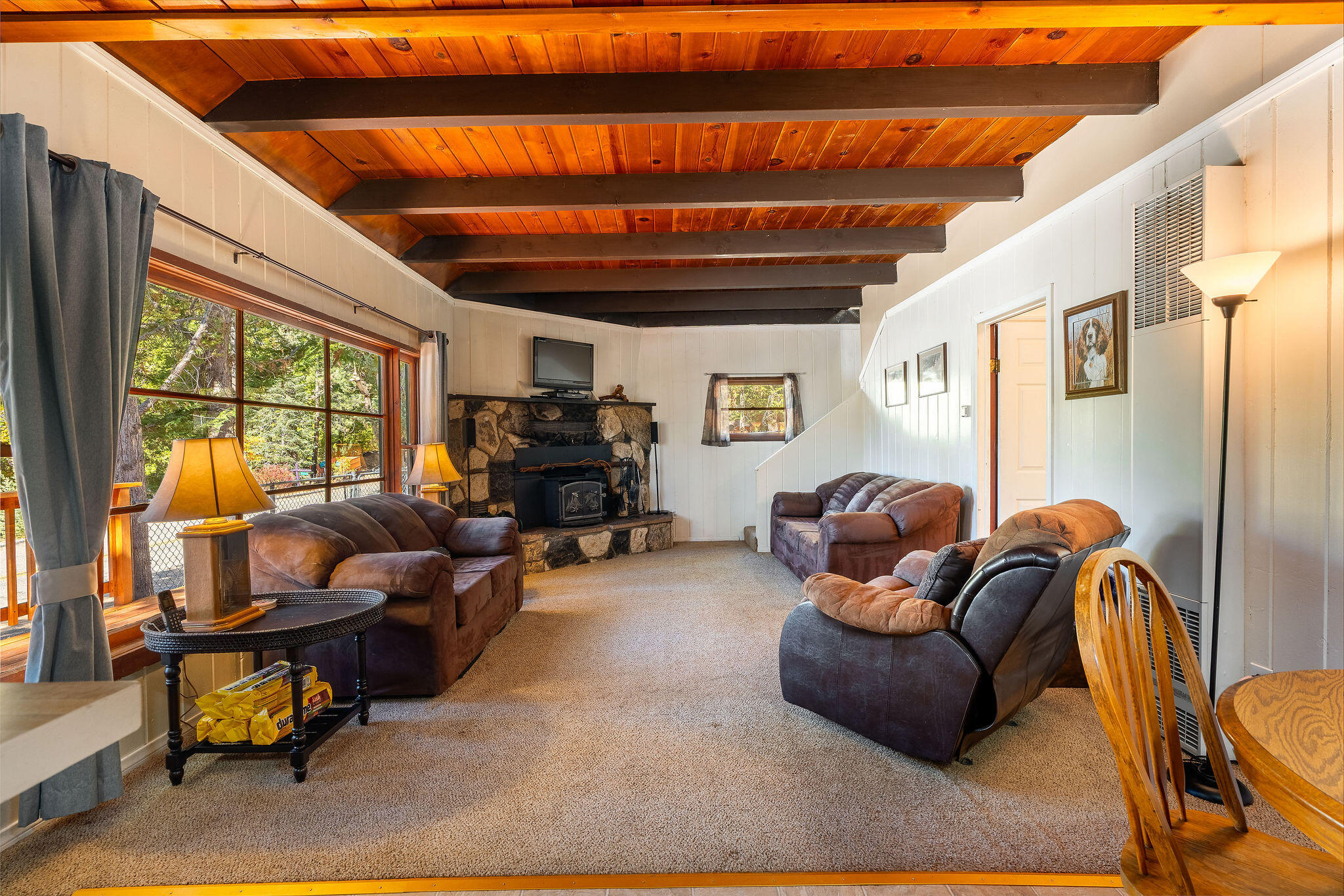 25290 Lodge Road Idyllwild, CA 92549 - Photo 8 of 46 a living room with furniture a ceiling fan and a window