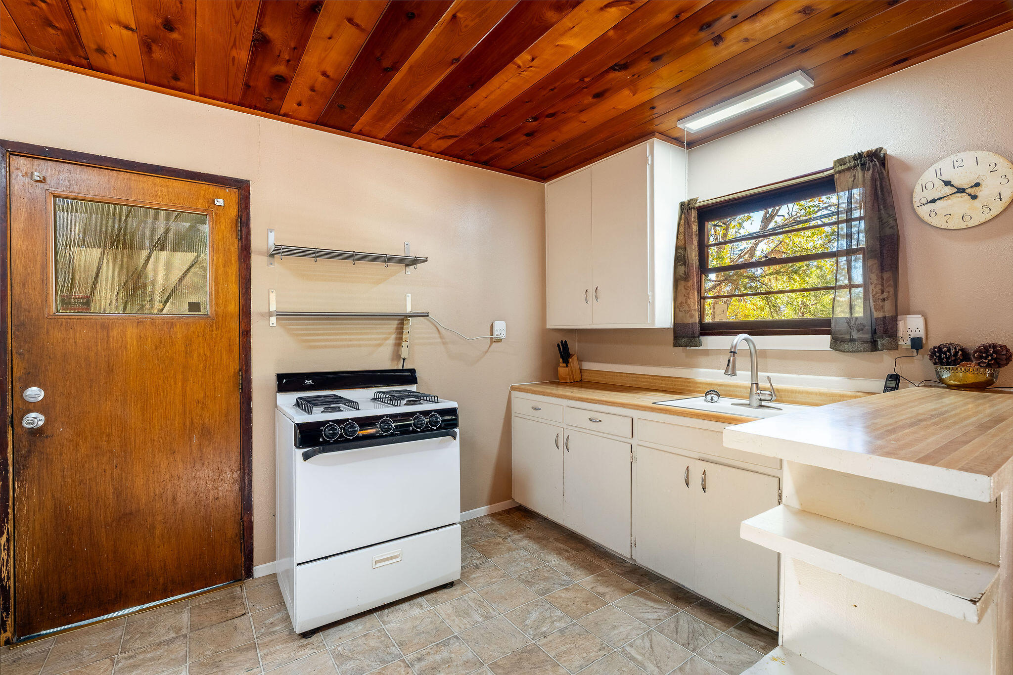 25290 Lodge Road Idyllwild, CA 92549 - Photo 9 of 46 a kitchen with a stove and a sink