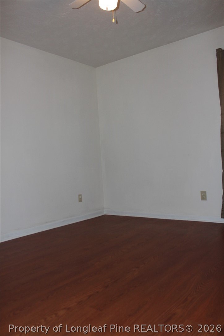 7805 Gallant Ridge Drive Fayetteville, NC 28314 - Photo 19 of 25 an empty room with wooden floor