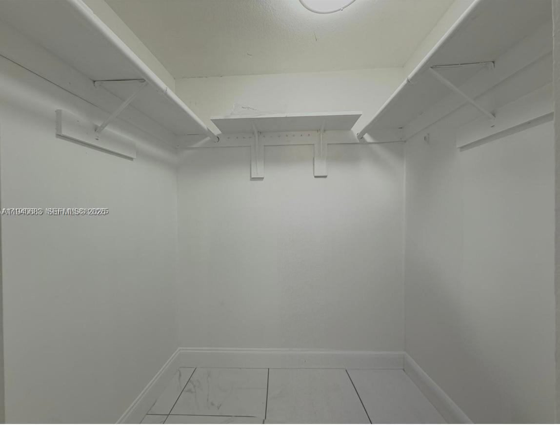 7610 Stirling Road, Unit 207F Davie, FL 33024 - Photo 13 of 22 a view of a room with white racks on the wall