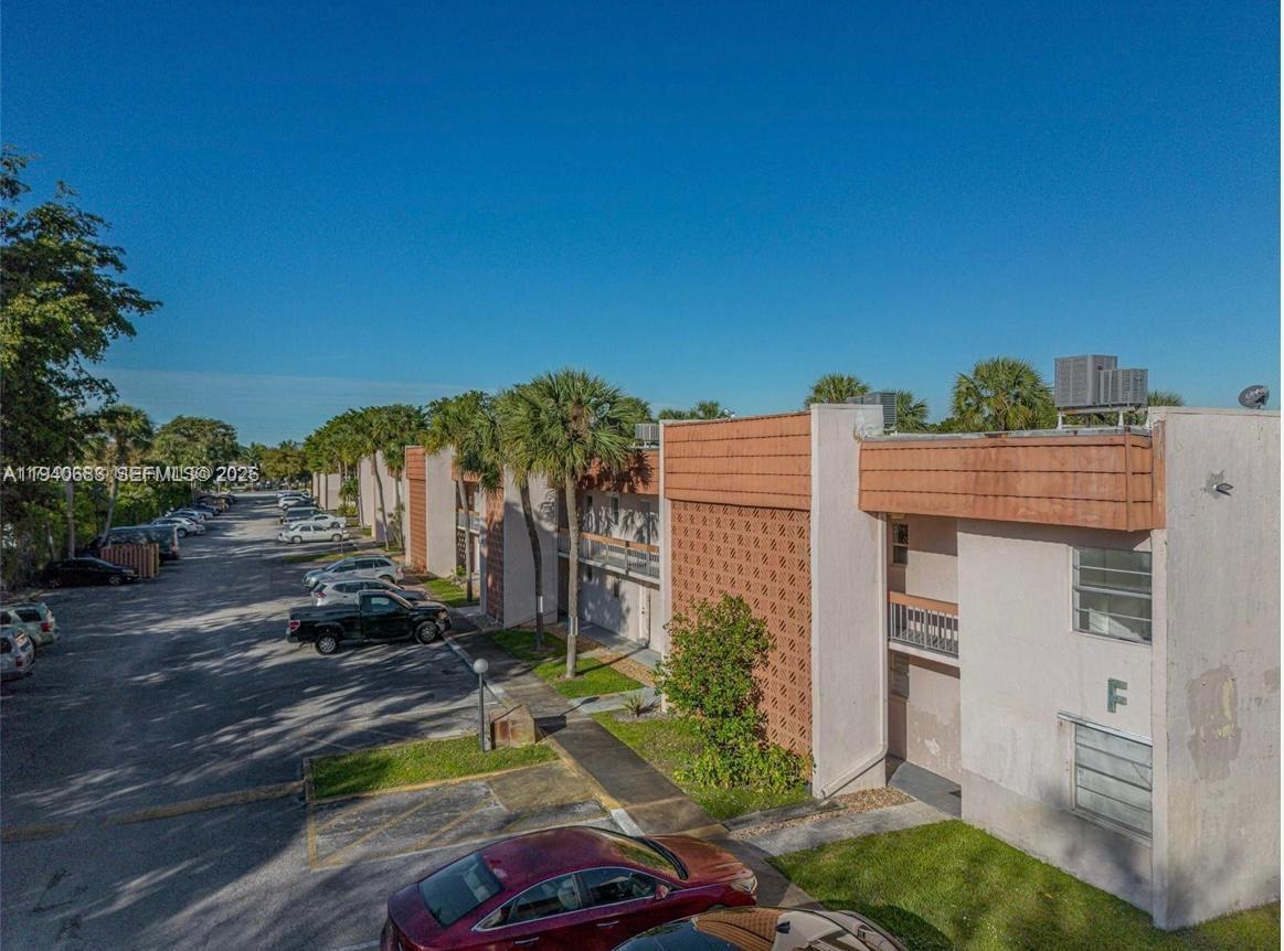 7610 Stirling Road, Unit 207F Davie, FL 33024 - Photo 18 of 22 front view of a house with a yard
