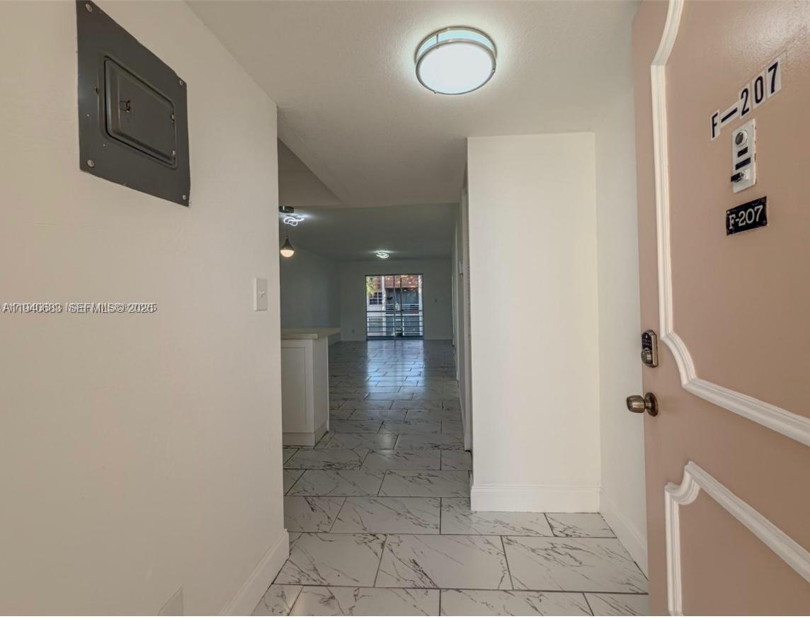 7610 Stirling Road, Unit 207F Davie, FL 33024 - Photo 2 of 22 a view of a hallway