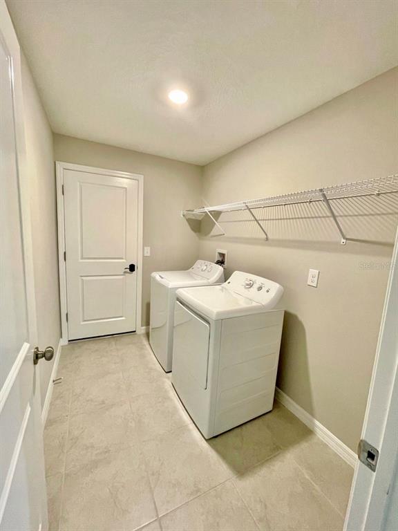 869 Anchor Bend Drive Ruskin, FL 33570 - Photo 13 of 23 a utility room with a washer and dryer