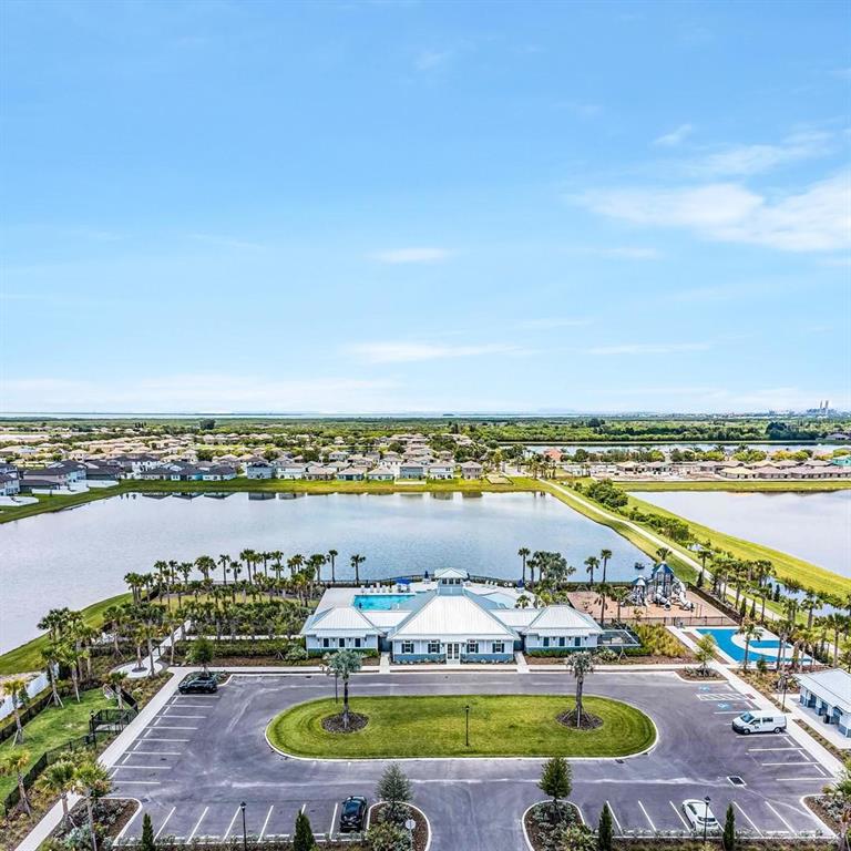 869 Anchor Bend Drive Ruskin, FL 33570 - Photo 20 of 23 a view of a swimming pool and an ocean view