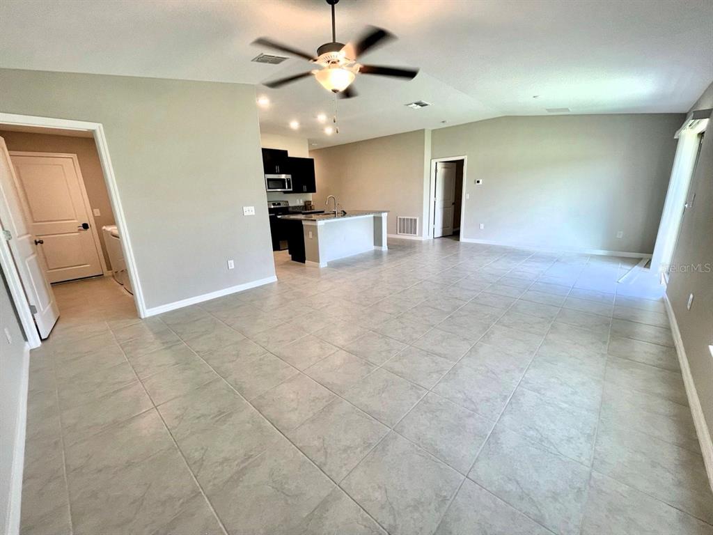 869 Anchor Bend Drive Ruskin, FL 33570 - Photo 7 of 23 a view of a kitchen with a sink and a refrigerator