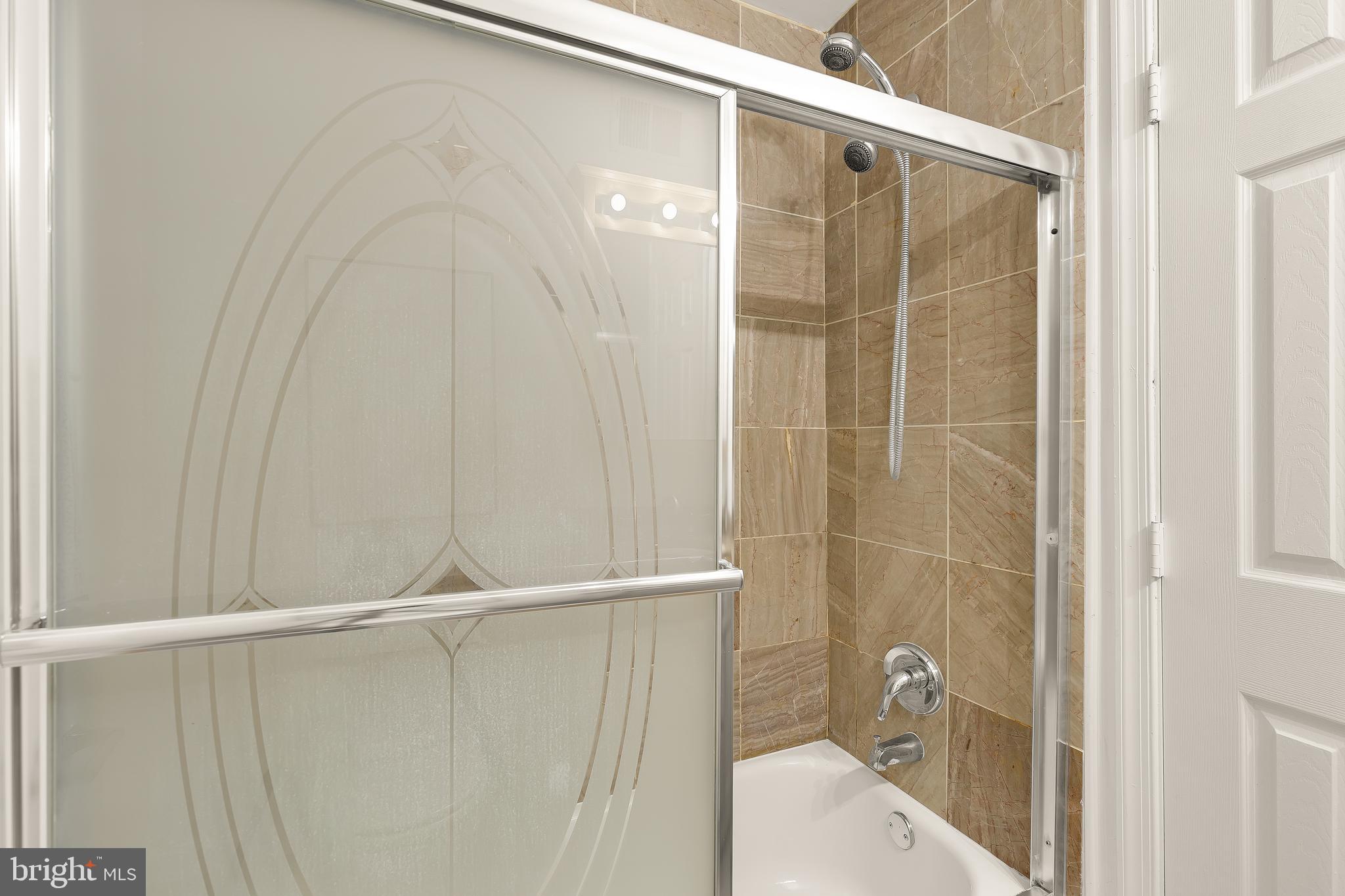 314 V Street Northeast, Unit 204 Washington, DC 20002 - Photo 8 of 13 a bathroom with a shower and a sink