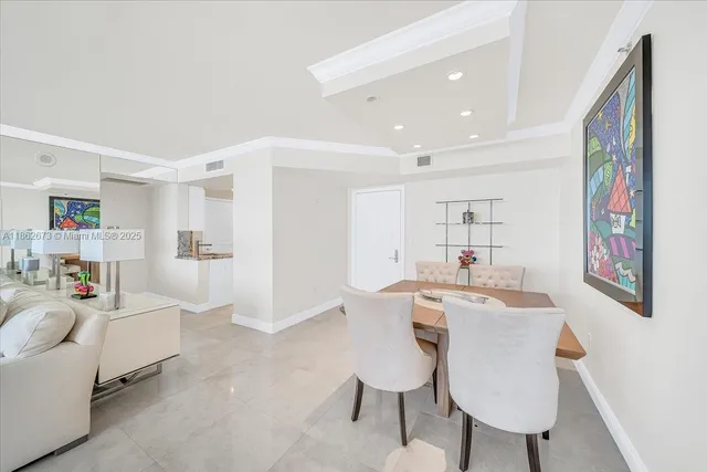 a kitchen with stainless steel appliances kitchen island granite countertop a refrigerator and a stove