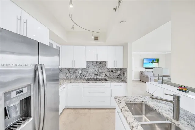 a bedroom with a bed and a night stand