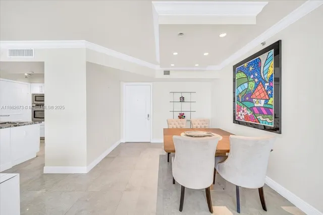 a bathroom with a tub shower sink and mirror