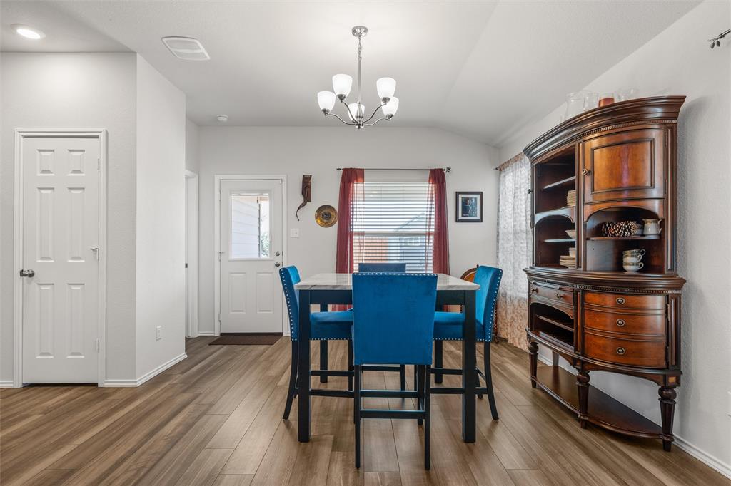 2912 Brosnan Road Lorena, TX 76655 - Photo 8 of 25 a view of a dining room with furniture and wooden floor