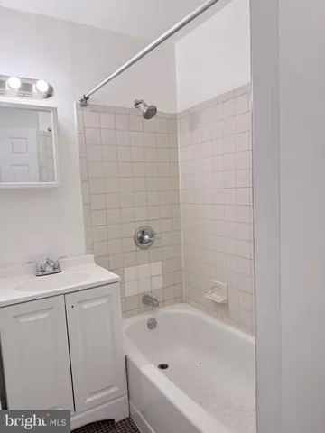 a wall with a microwave and cabinets