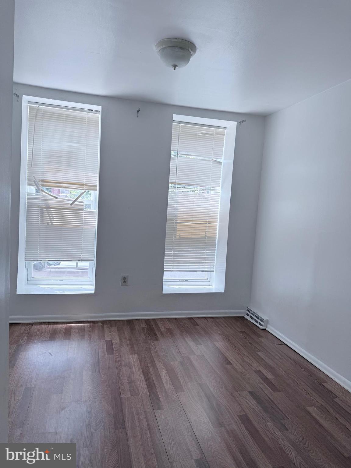 1820 West Fayette Street, Unit 1 Baltimore, MD 21223 - Photo 16 of 19 a view of room with window and wooden floor