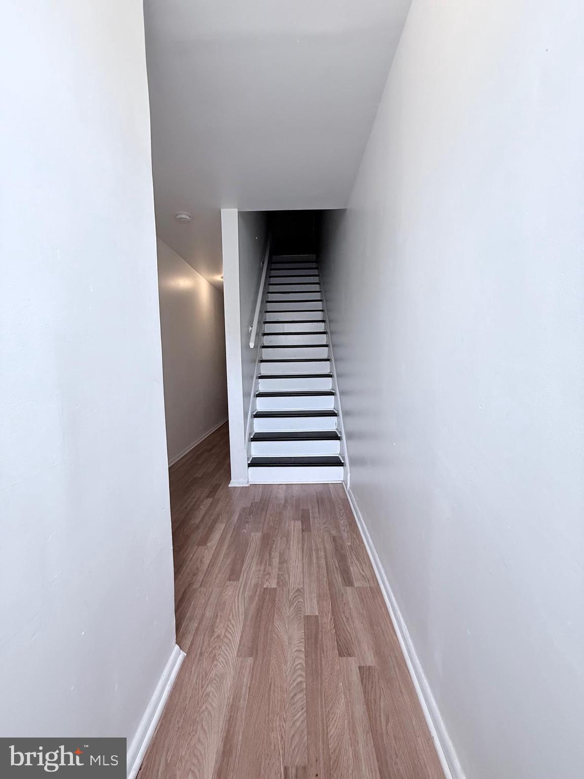 1820 West Fayette Street, Unit 1 Baltimore, MD 21223 - Photo 3 of 19 a view of a hallway with wooden floor and entryway