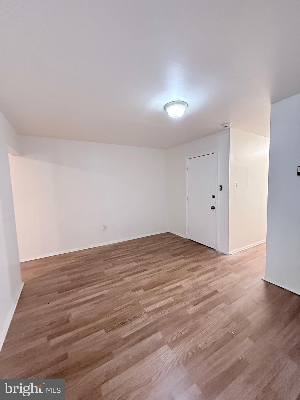 1820 West Fayette Street, Unit 1 Baltimore, MD 21223 - Photo 7 of 19 a view of empty room with wooden floor