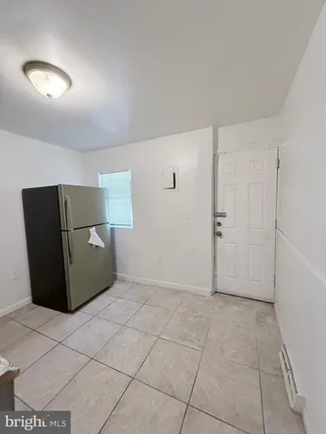 a kitchen with cabinets and white appliances