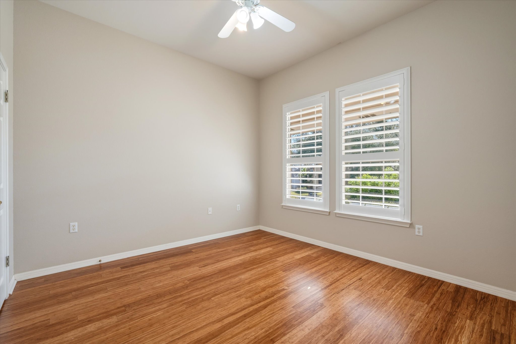 114 Whippoorwill Way Georgetown, TX 78633 - Photo 18 of 37 a view of an empty room with wooden floor and a window
