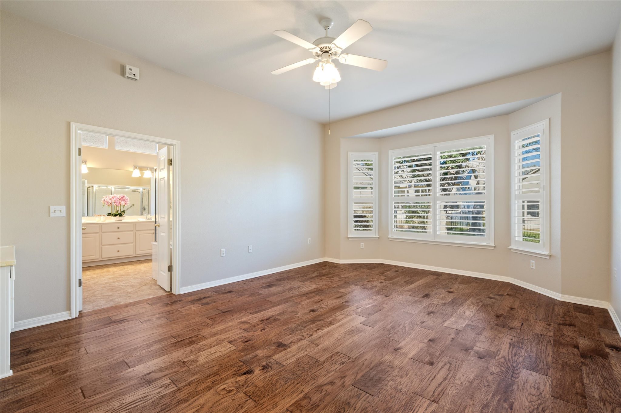 114 Whippoorwill Way Georgetown, TX 78633 - Photo 20 of 37 a view of an empty room with a window and a kitchen