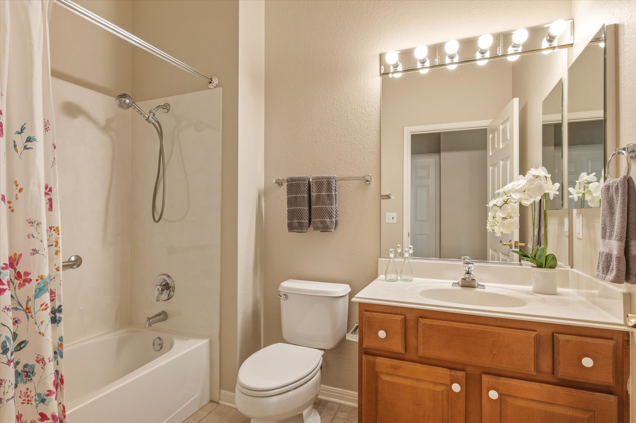 114 Whippoorwill Way Georgetown, TX 78633 - Photo 27 of 37 a bathroom with a granite countertop sink a toilet and shower