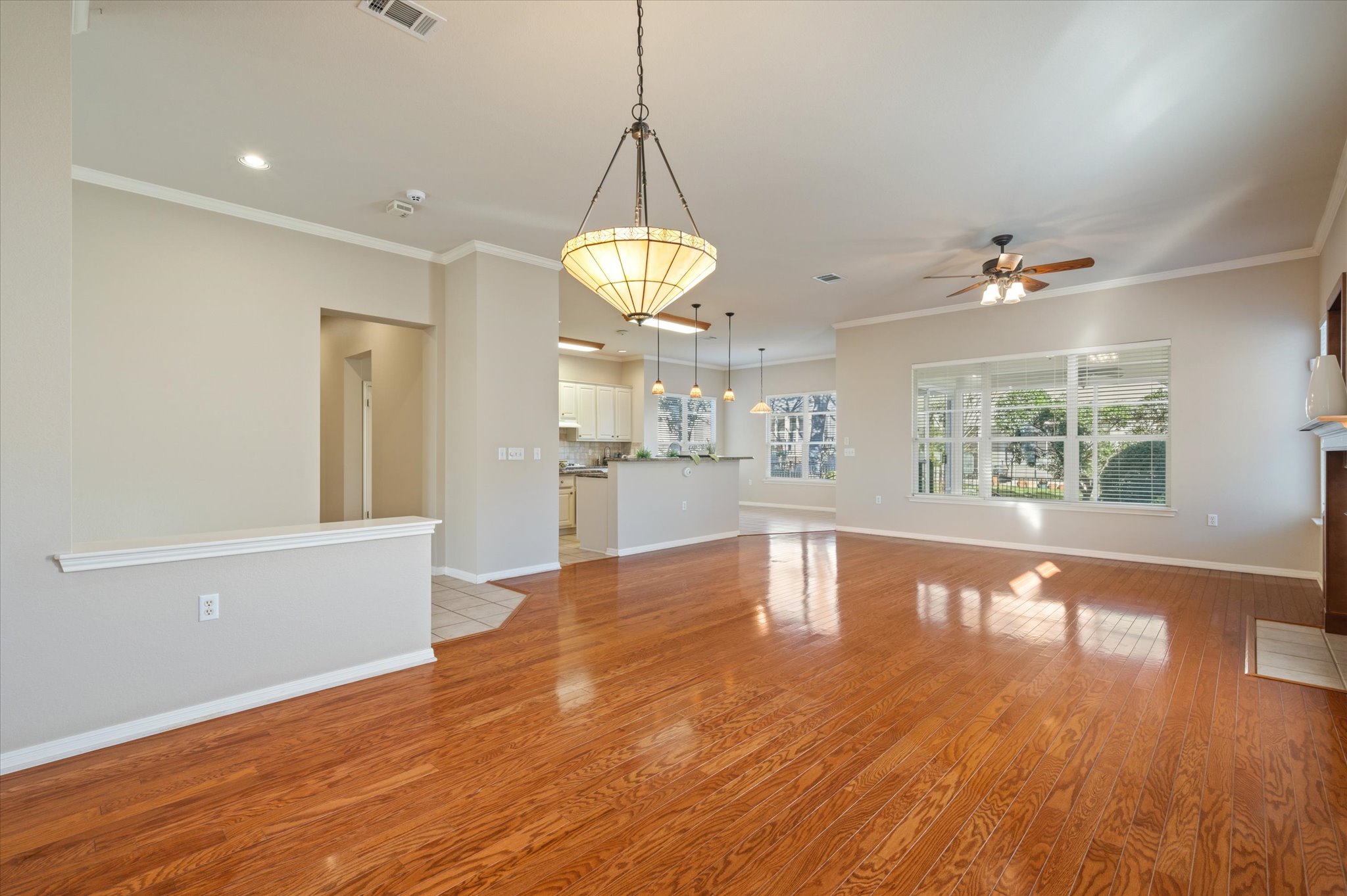 114 Whippoorwill Way Georgetown, TX 78633 - Photo 8 of 37 a view of a kitchen with wooden floor and a window