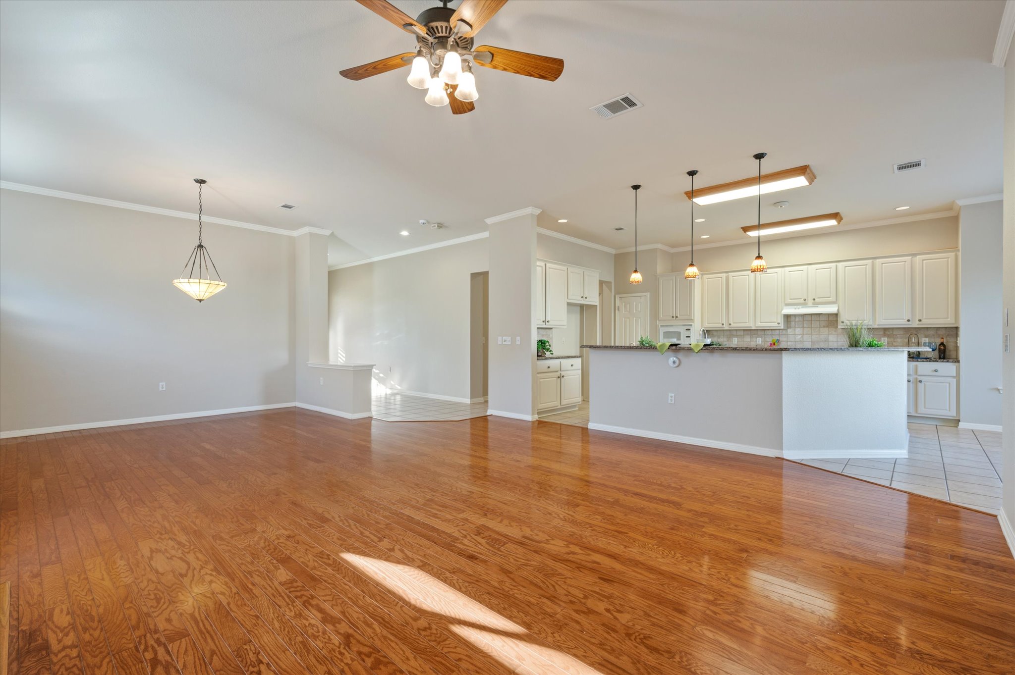 114 Whippoorwill Way Georgetown, TX 78633 - Photo 9 of 37 a view of a kitchen with a stove cabinets and wooden floor