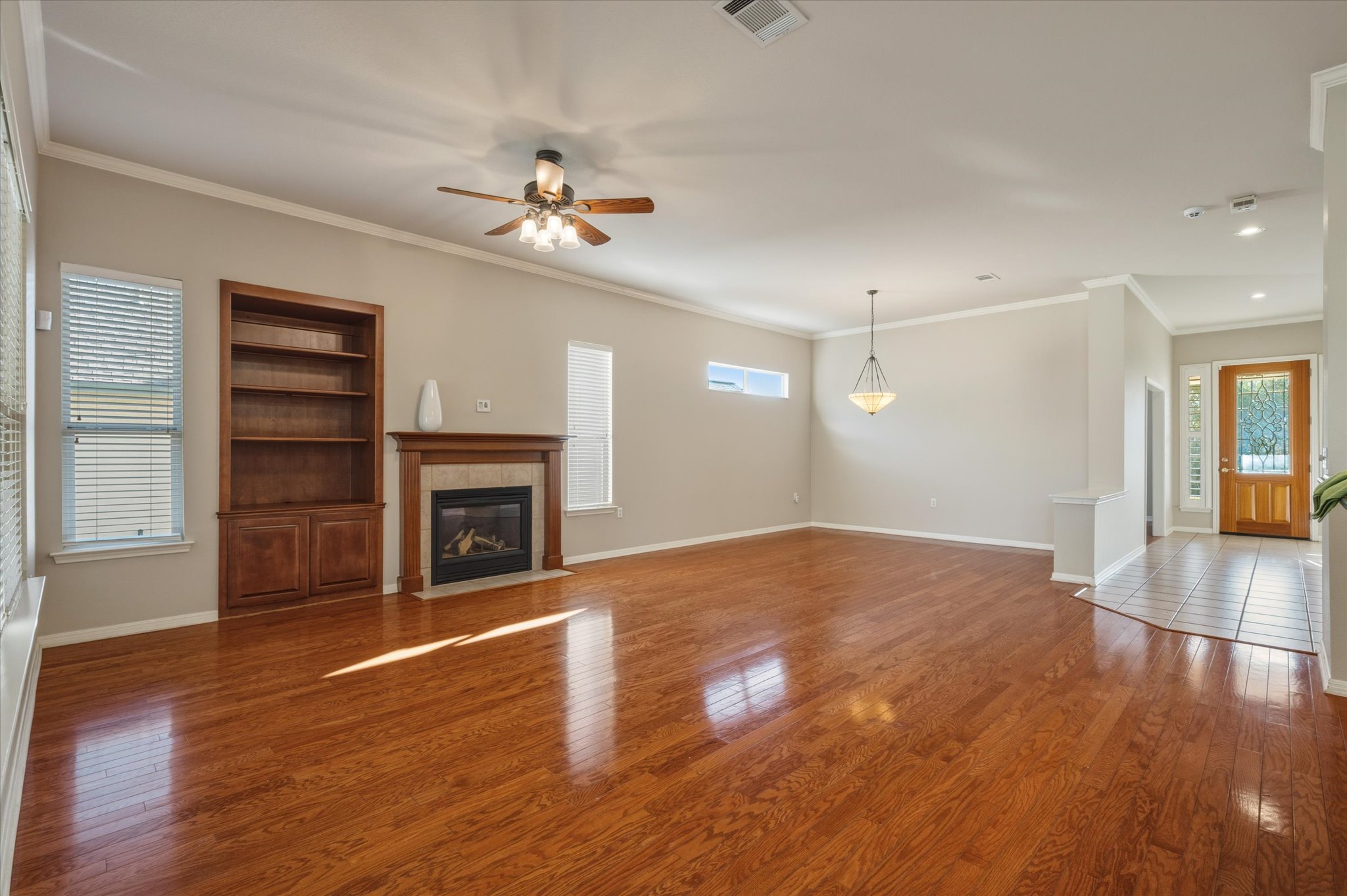 114 Whippoorwill Way Georgetown, TX 78633 - Photo 10 of 37 a view of empty room with wooden floor and fireplace