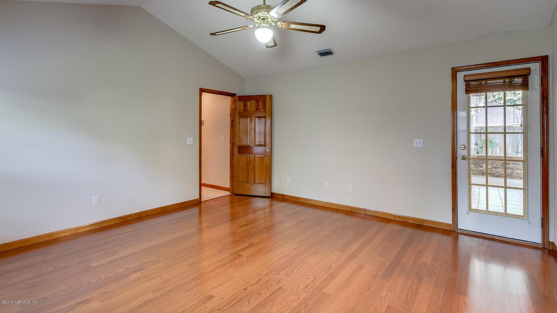 60 River Road Orange Park, FL 32073 - Photo 17 of 25 Owner suite/ door leading to lanai